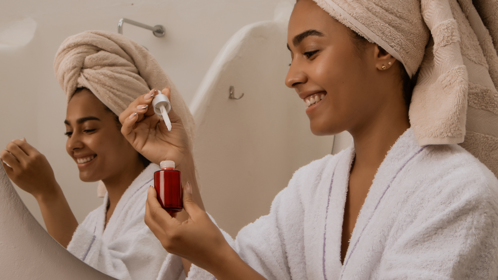 woman applying serum on her skin